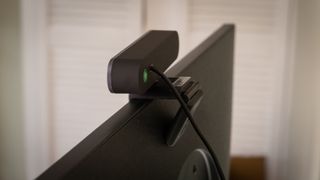 Depstech DW49 Pro 4K webcam mounted on top of a PC monitor