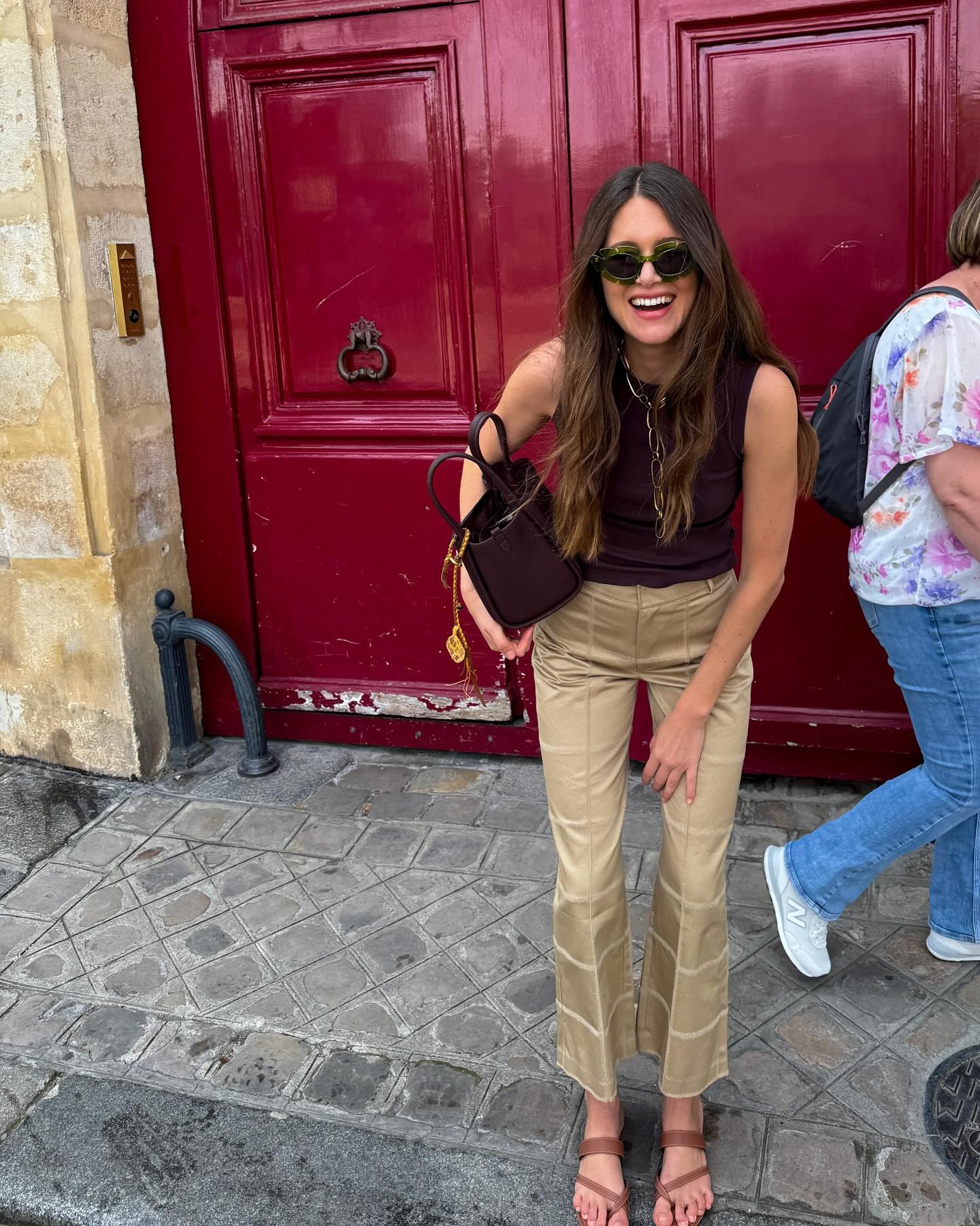 @saraloura wearing khaki pants with a black tank.