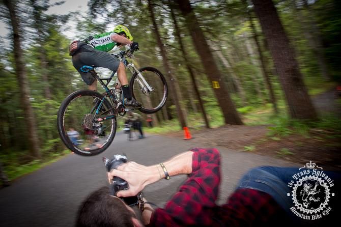 Cody Philips hits the gap over the road for the crowd of photographers
