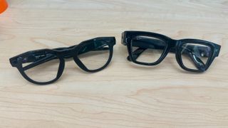 A photo of Oakley Meta HSTN (left) and Meta Ray-Ban Display (right) smart glasses next to each other, folded and facing upward.