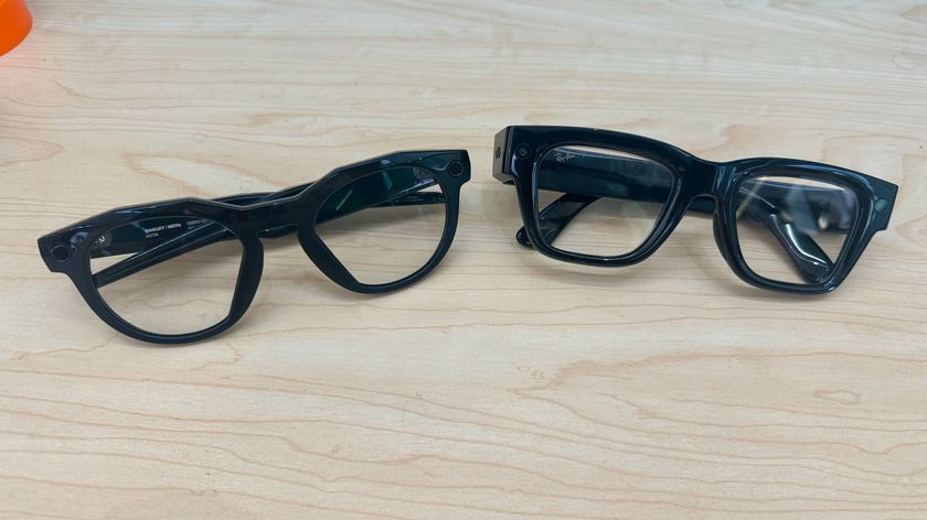A photo of Oakley Meta HSTN (left) and Meta Ray-Ban Display (right) smart glasses next to each other, folded and facing upward.