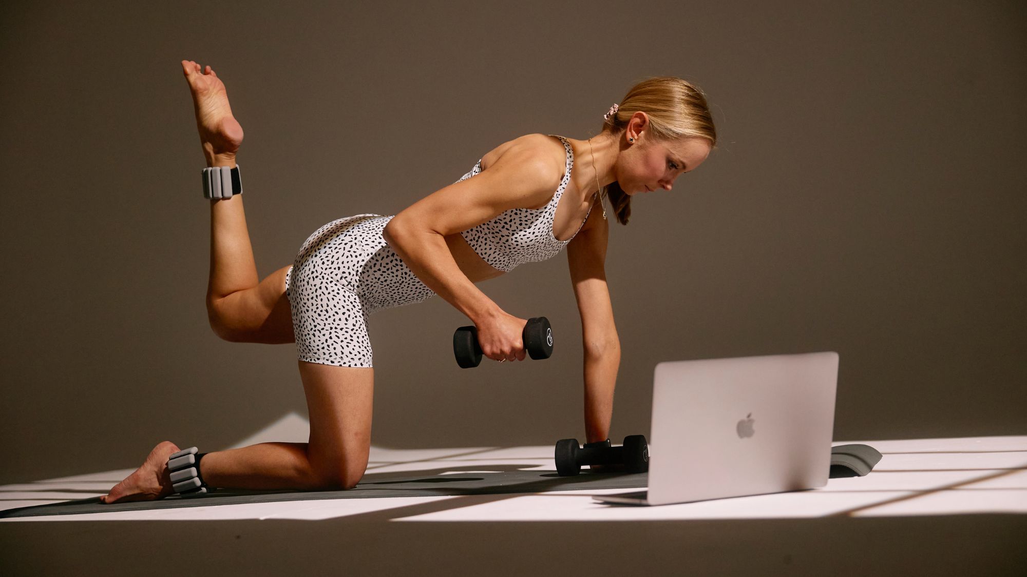 Sam Deville working out using ankle weights