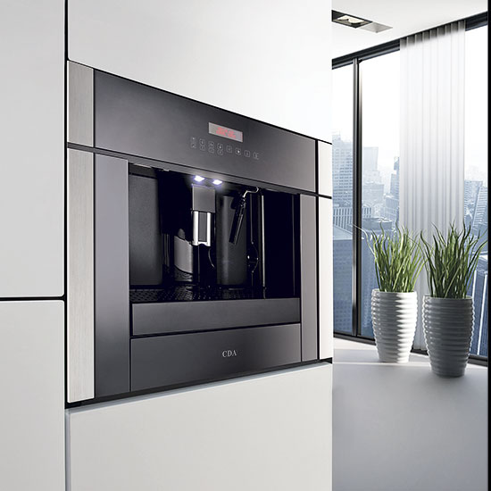 Coffee machine with white cabinet and potted plants