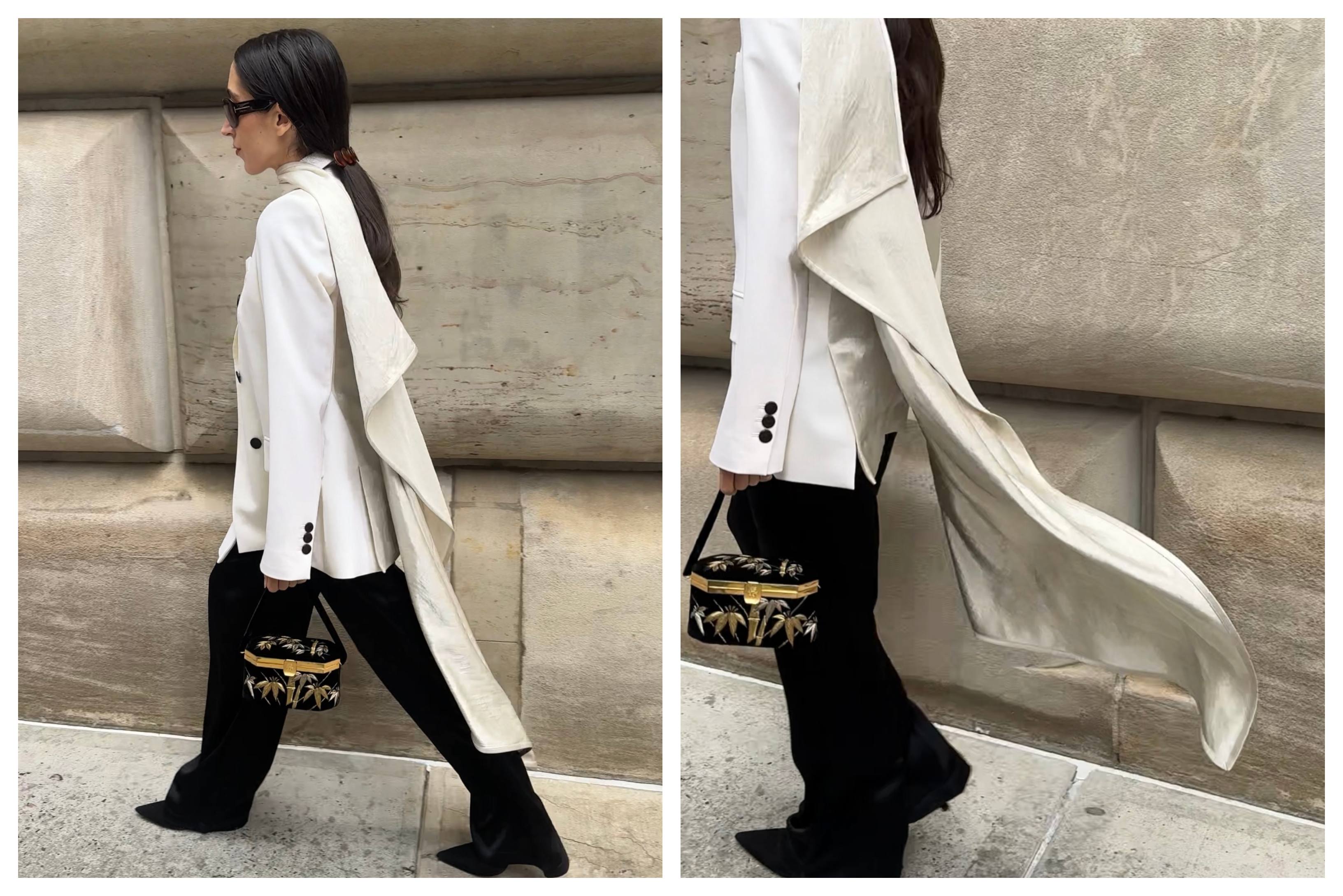 Alexis Badiyi attends New York Fashion Week in a white jacket and black pants