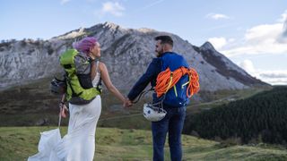 Bridal couple with climbing backpacks at Urkiola mountain, Spain