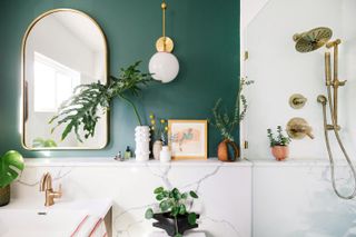 bathroom with white marble and green feature wall