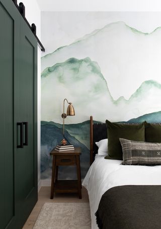 A bedroom with feature ombre watercolour wall