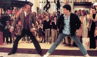 Big Robert Loggia and Tom Hanks dance on the big piano