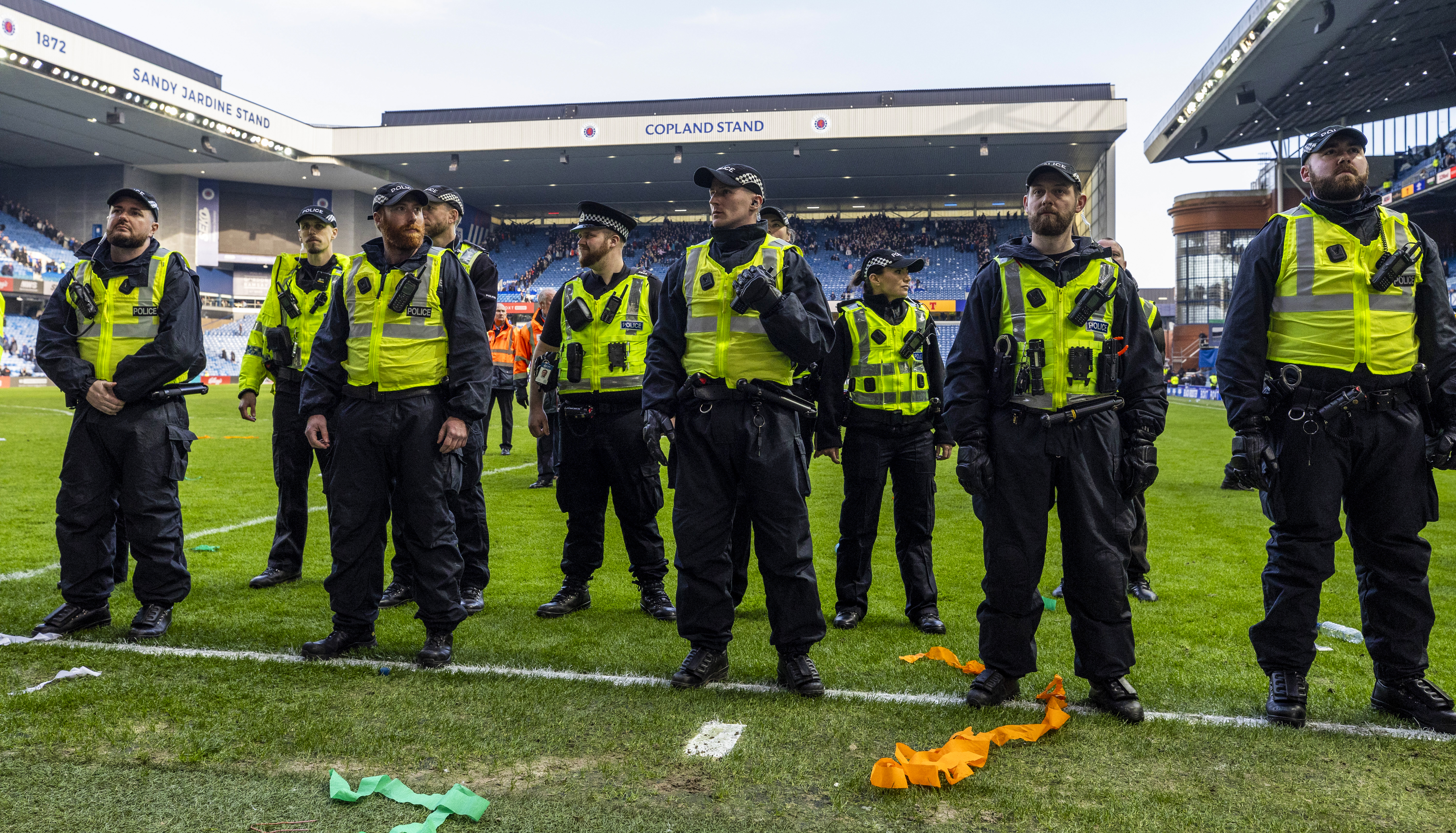 GLASGOW, SCOTLAND - MARCH 08: Police line up to block fans from storming the pitch during a Scottish Gas Scottish Cup Quarter-Final match between Rangers and Celtic at Ibrox Stadium, on March 08, 2026, in Glasgow, Scotland. (Photo by Craig Williamson/SNS Group via Getty Images)