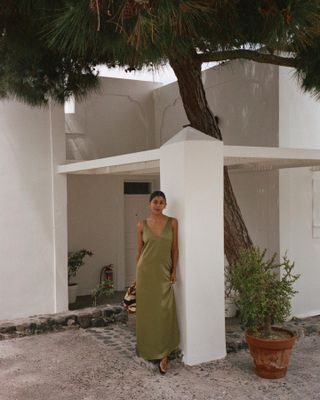 Influencer styles an olive green dress.