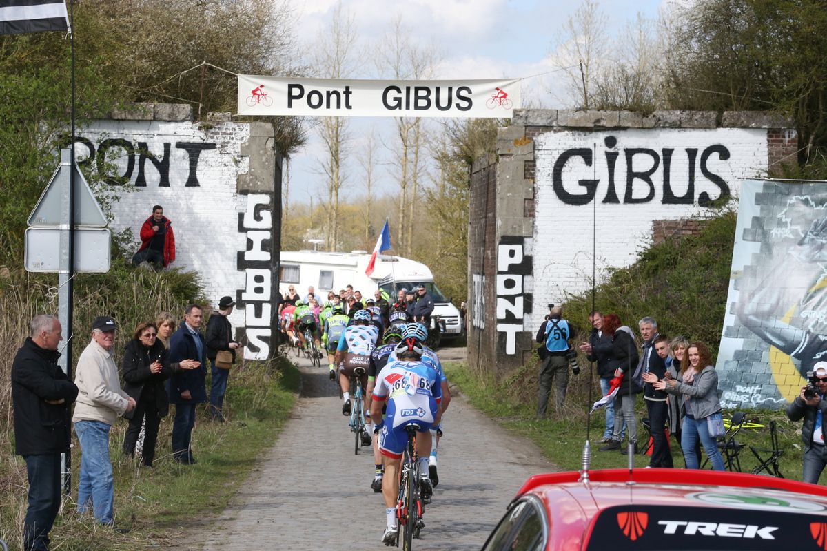 The peloton approaches Pont Gibus during the race