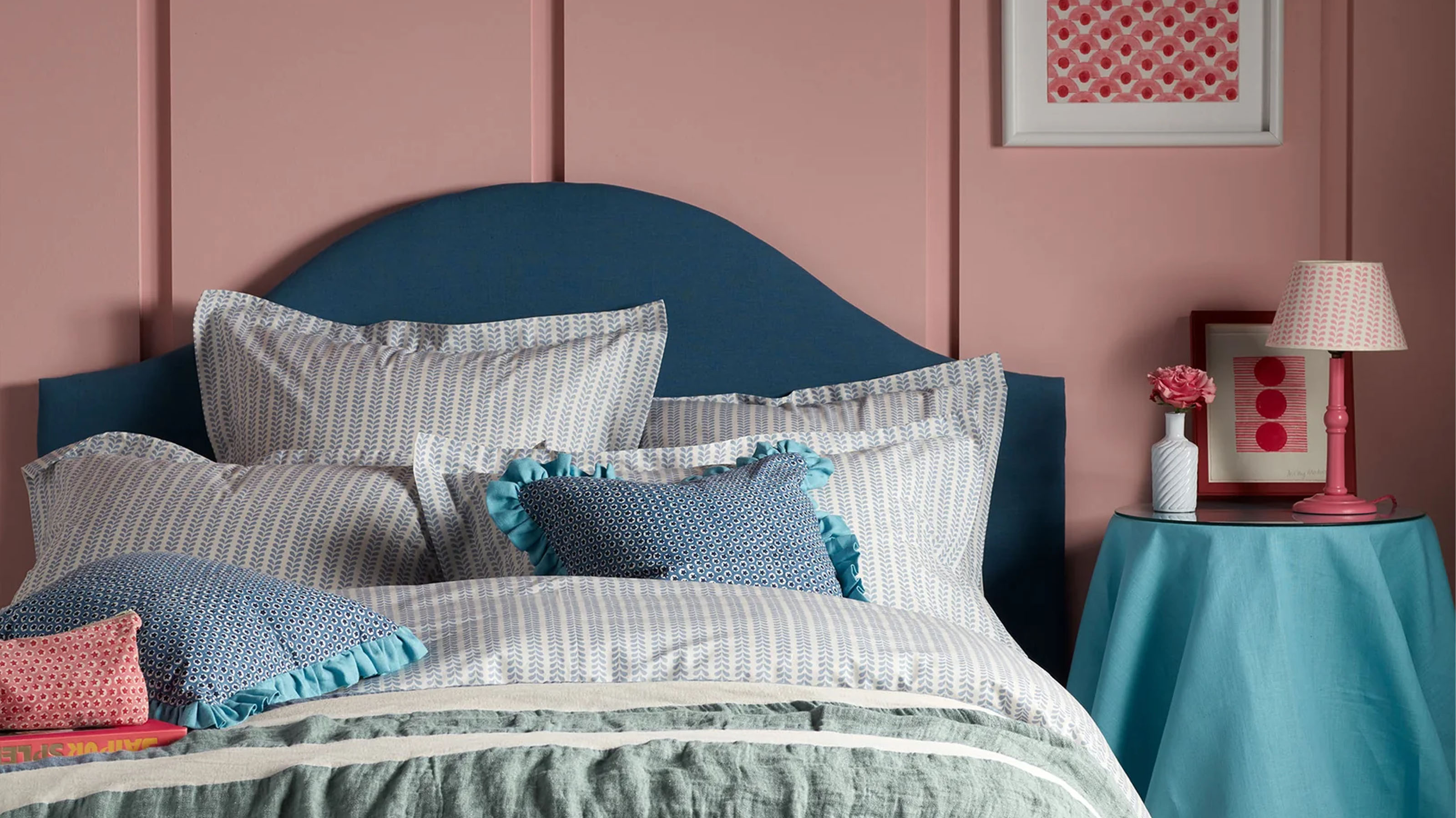 Secret Linen Store Molly Mahon Blue Bindi 100% Cotton Bed Linen on a bed in a pink bedroom