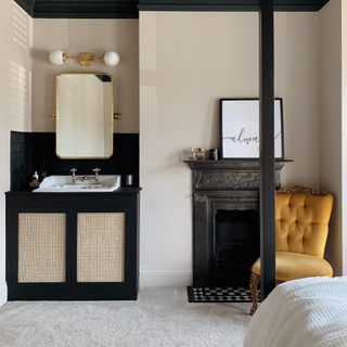 bedroom with sink area and fireplace