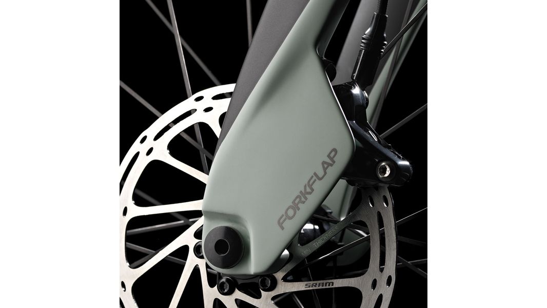 The bike features aero-friendly flaps that shroud the front caliper