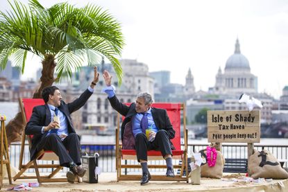Protesters set up a fake tax haven in London.