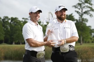 Rory McIlroy and Shane Lowry hold the Zurich Classic trophy