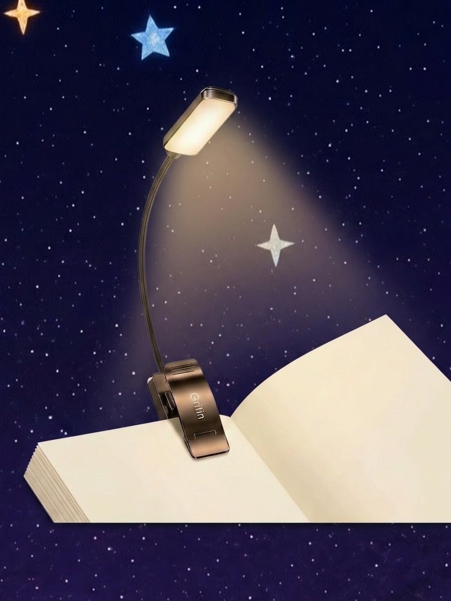 A Gritin Book Light attached to a book against a starry background edited by Gemini