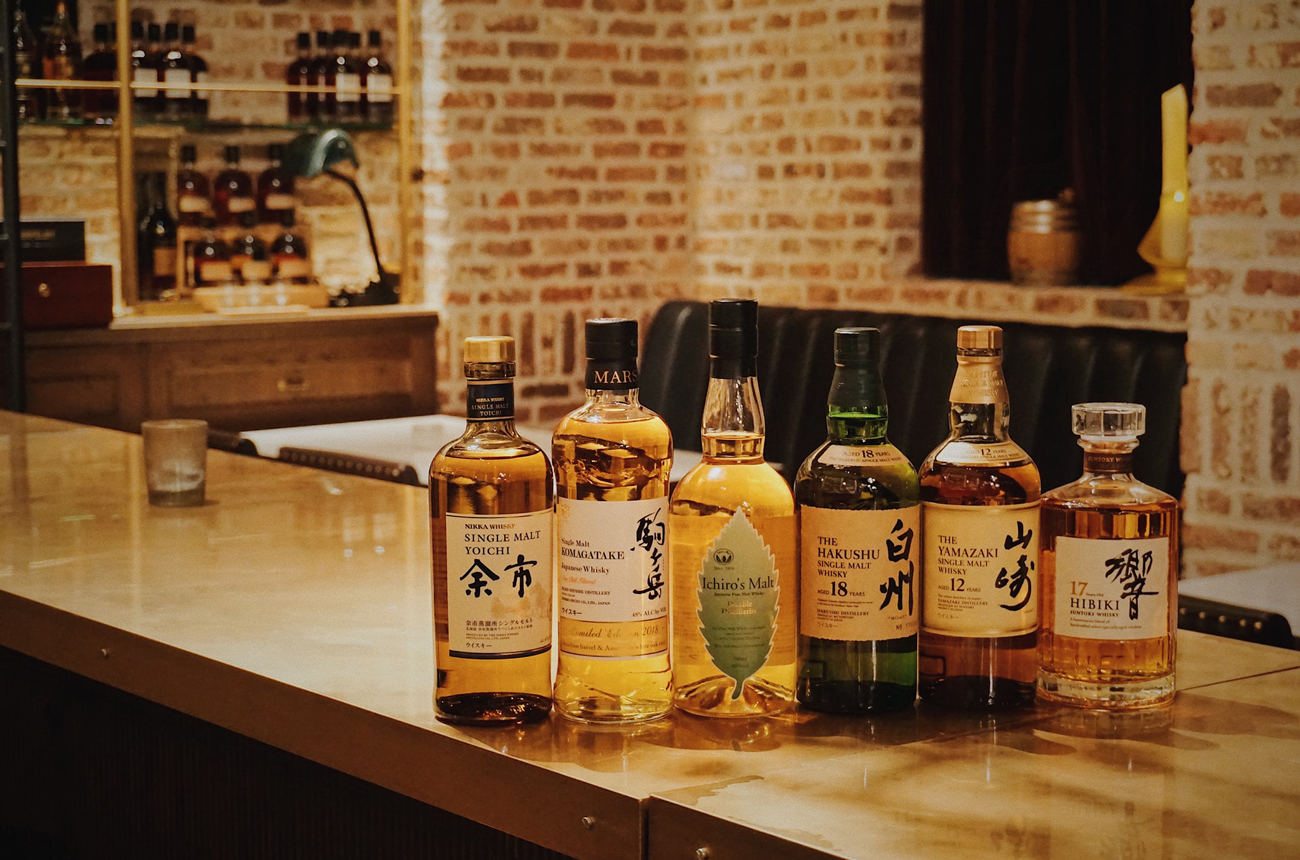 A row of Japanese whisky bottles at The Whisky Library in Tokyo