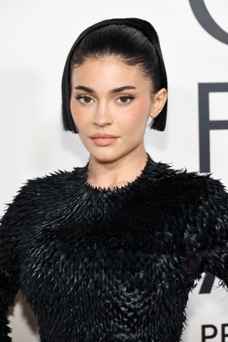 Kylie Jenner wears a spiky black dress on the red carpet at the 2024 CFDA Fashion Awards