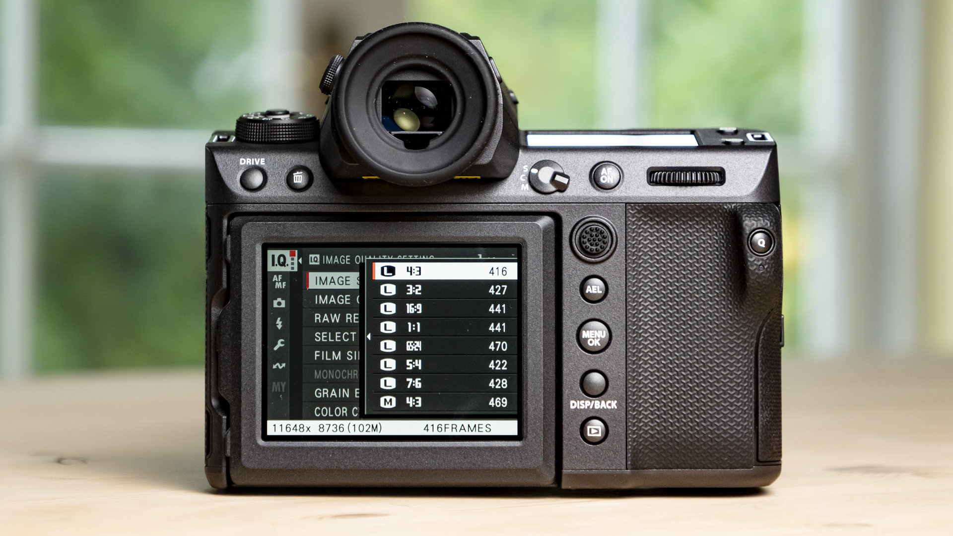 Rear of the Fujifilm GFX100 II on a wooden table