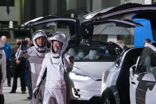 NASA astronauts Shannon Walker (right) and Shane Kimbrough (left) walk out before the Crew-2 launch.