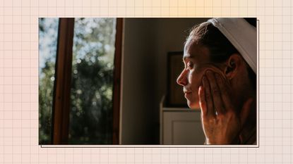 woman massaging oil into her face