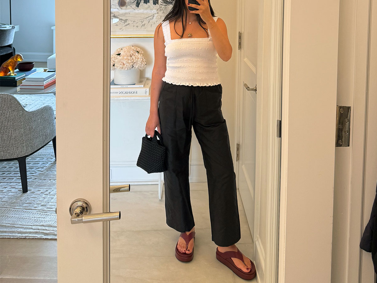 @nicoleakhtarzad wearing a smocked tank and black cargo pants.
