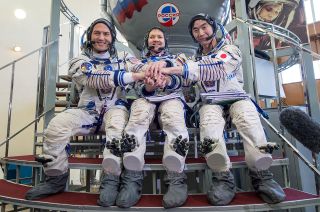 NASA astronaut Kjell Lindgren (left), cosmonaut Oleg Kononenko and JAXA astronaut Kimiya Yui form the Soyuz TMA-17M crew.