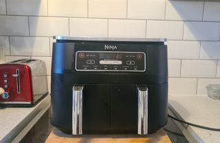 Ninja foodi air fryer on the kitchen counter
