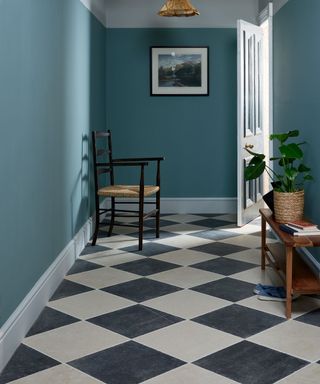 Blue hallway, black and white tile floor
