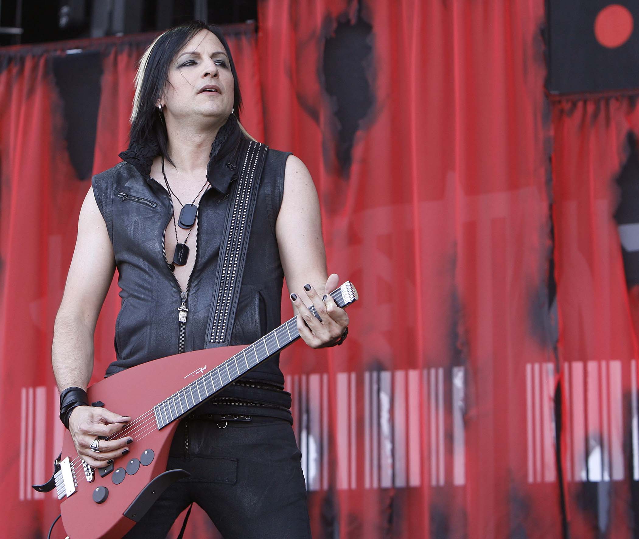 Amir Derakh plays a synth-guitar onstage