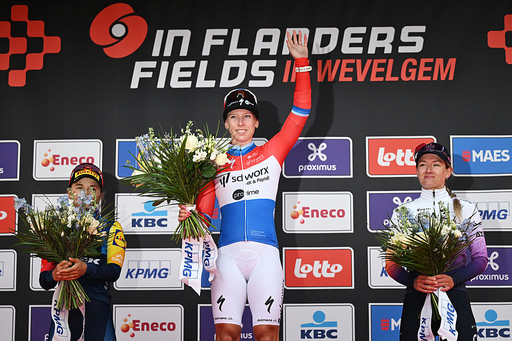 WEVELGEM, BELGIUM - MARCH 29: (L-R) Fleur Moors of Belgium and Team Lidl - Trek on second place, race winner Lorena Wiebes of Netherlands and Team SD Worx - Protime and Karlijn Swinkels of Netherlands and UAE Team ADQ on third place pose on the podium ceremony after 13th In Flanders Fields - From Middelkerke to Wevelgem 2026 - Women's Elite a 135.2km one day race from Wevelgem to Wevelgem / #UCIWWT / on March 29, 2026 in Wevelgem, Belgium. (Photo by Luc Claessen/Getty Images)