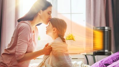 Mother and daughter in front of Dreo space heater