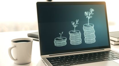 Laptop showing money growing