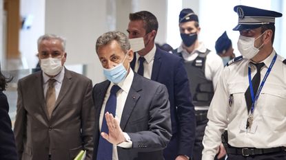 Nicolas Sarkozy arrives at court for the verdict of his trial for corruption