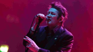 The Pogues’ Shane MacGowan performing onstage in 2013