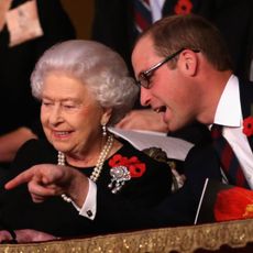 Prince William smiling next to Queen Elizabeth