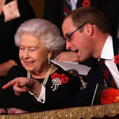 Prince William smiling next to Queen Elizabeth