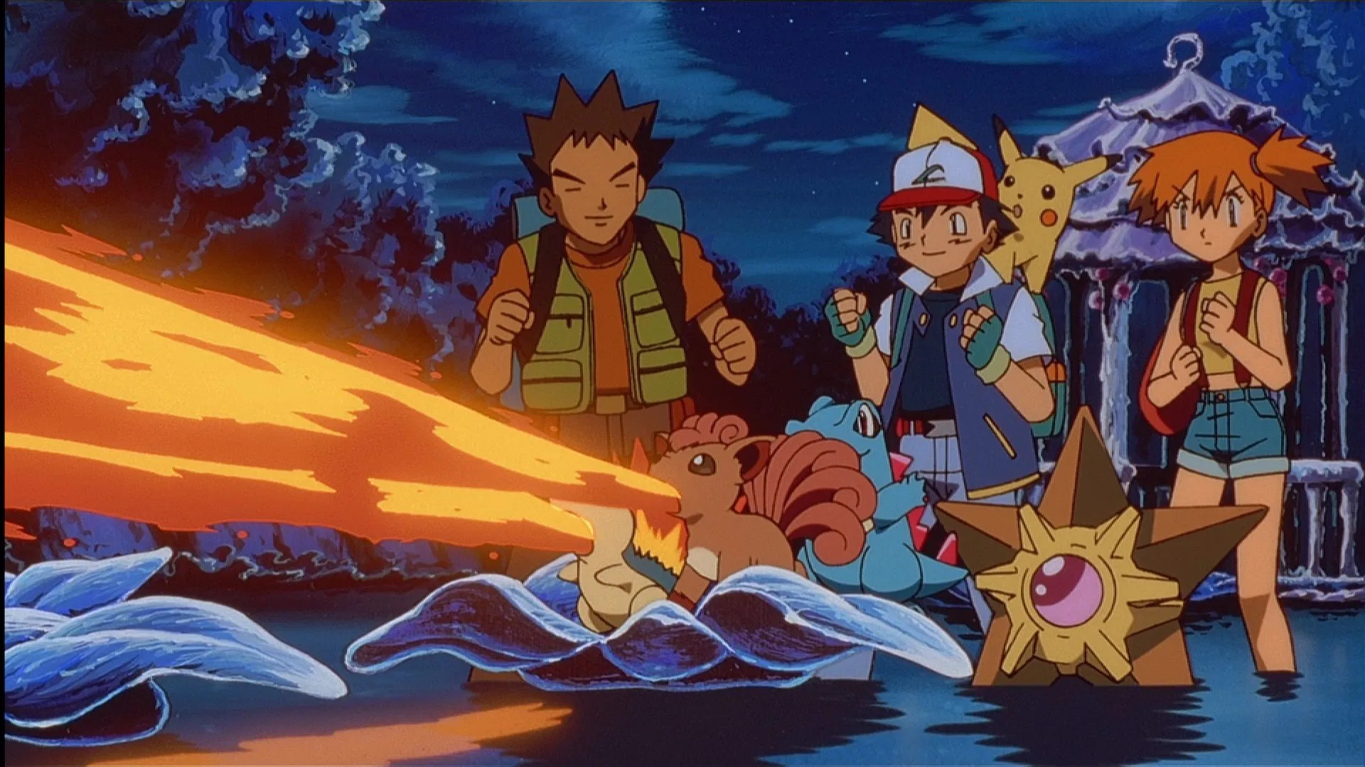 Vulpix shooting a fire beam from its mouth while Misty, Brock and Ash cheer it on during Pokemon 3: The Movie.