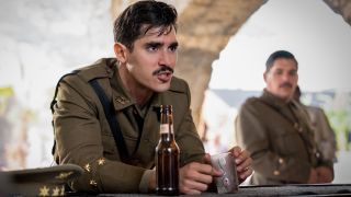 Henrique Zaga sits frustrated at a bar in The Ministry of Ungentlemanly Warfare.
