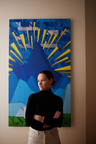 Sonya Soltes in front of painting