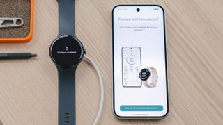 Google Pixel Watch 3 next to a Pixel 9 smartphone showing the wearable's Fitbit setup screen