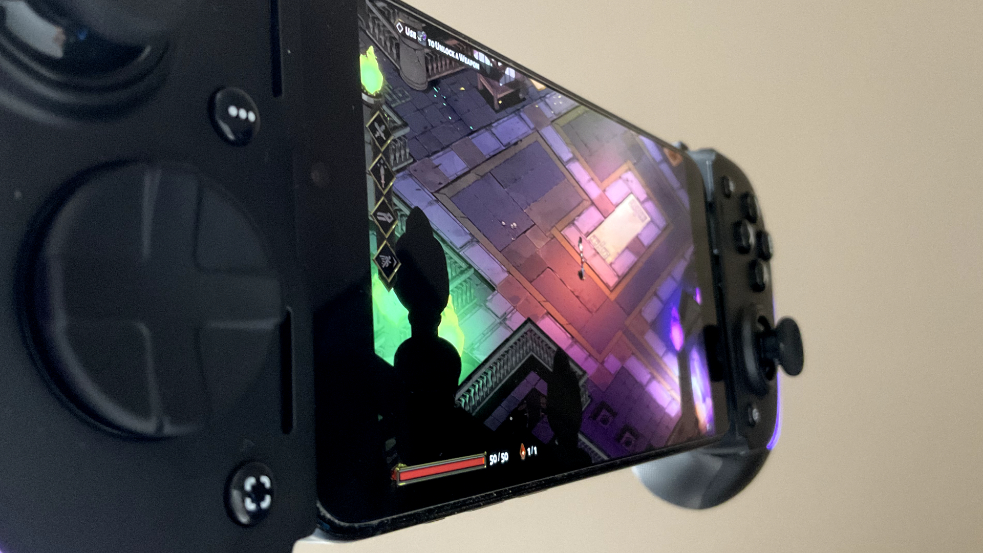 Razer Kishi Ultra showing Hades on iPhone 15 Pro Max