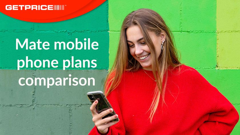 Girl wearing red jumper holding a mobile phone and smiling at it in front of a green wall with the red GetPrice logo on the top left corner and white writing underneath that says &#039;Mate mobile phone plans comparison&#039;