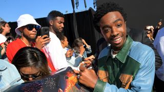 Caleb McLaughlin at a signing event for the Netflix series "Stranger Things."