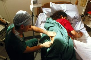Woman having an epidural