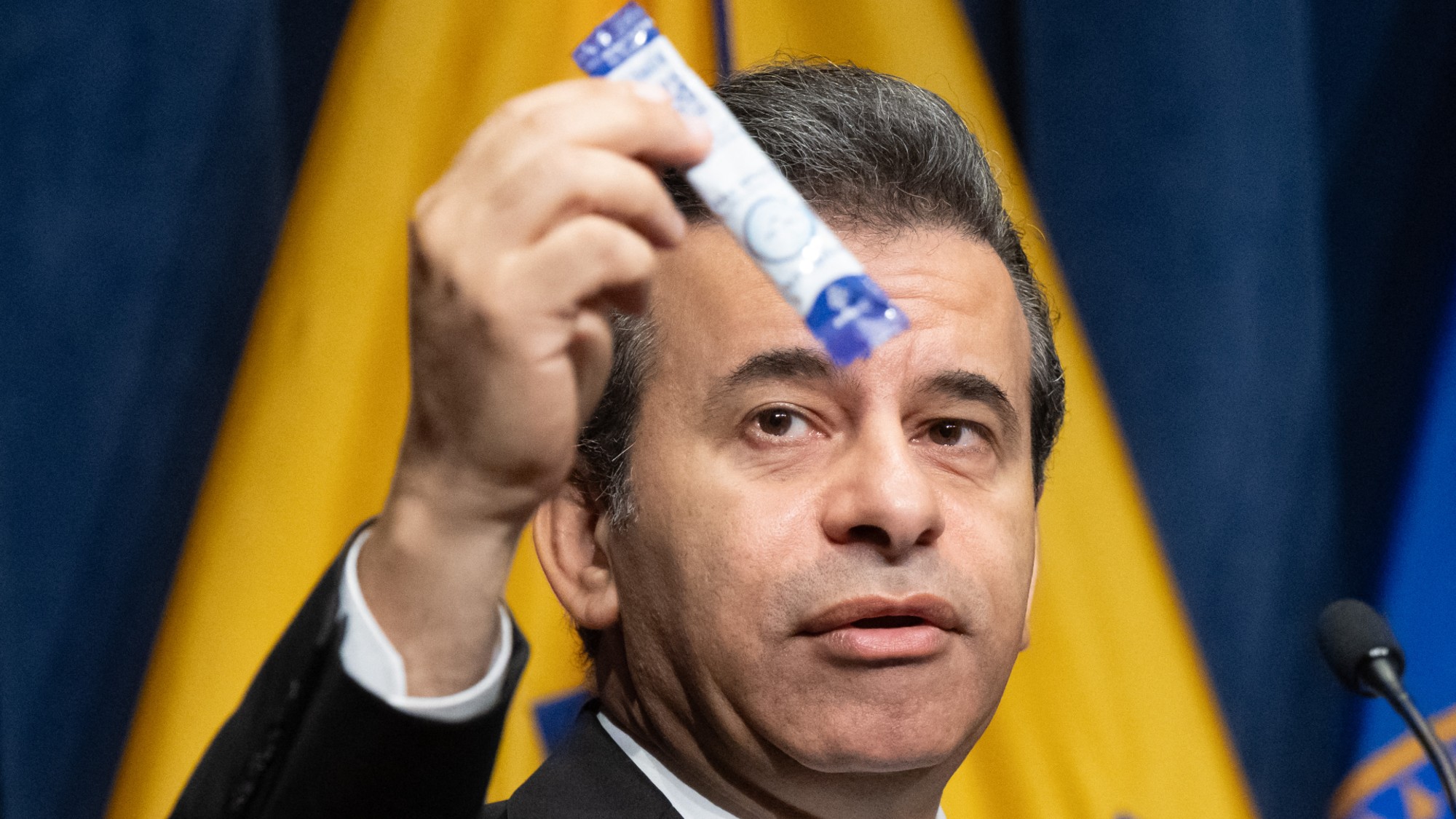 FDA Commissioner Dr. Marty Makary holds up a 7-OH product during a press conference