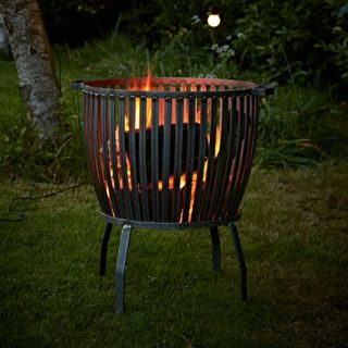 Best fire pit in open field at night with flame on