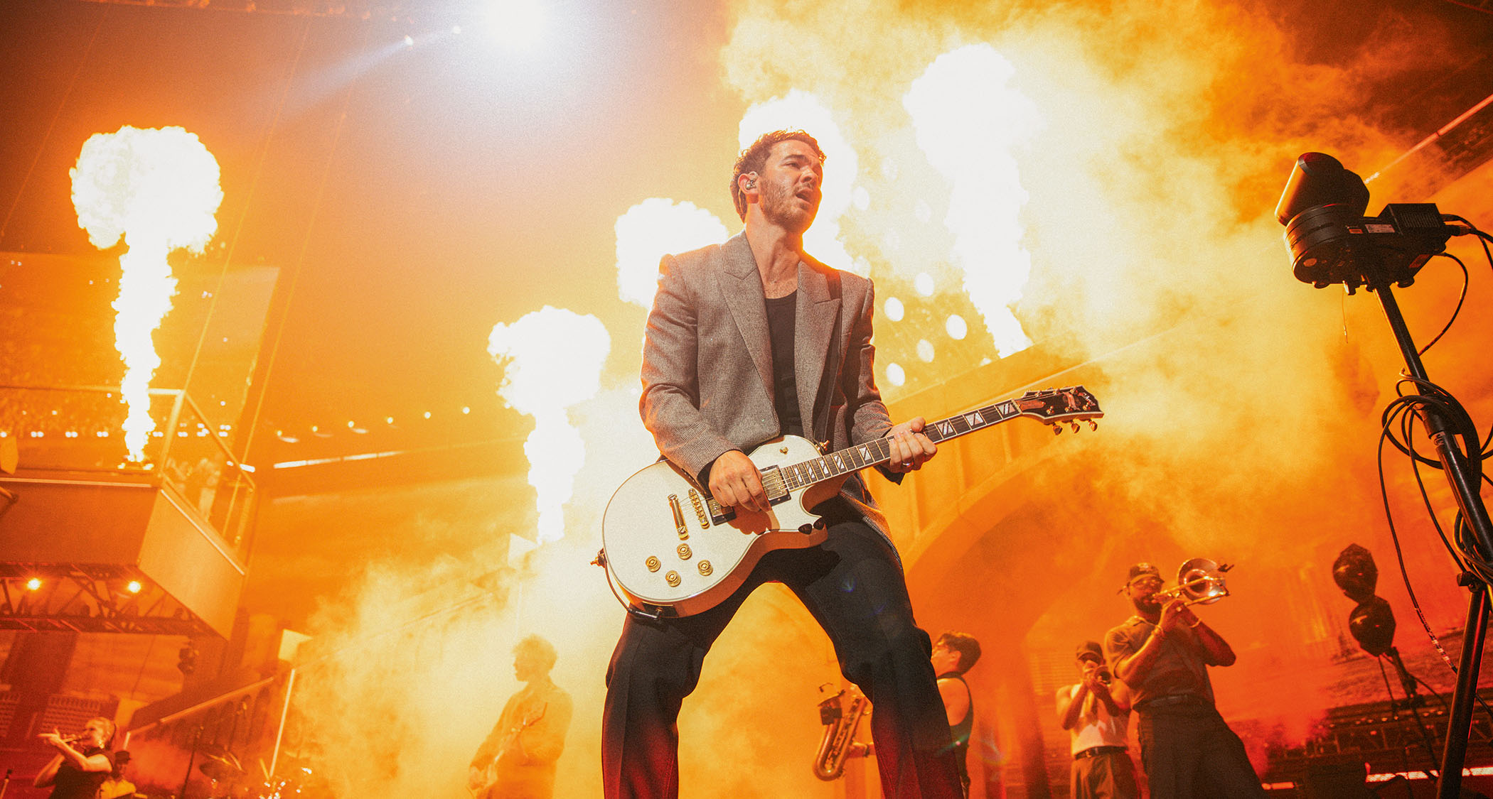 Kevin Jonas of the Jonas Brothers performs live with a white Les Paul