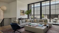 A living room area with grey sofas